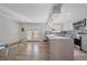 Modern kitchen with island, stainless steel appliances, and access to backyard at 1827 Quail St # 3, Lakewood, CO 80215