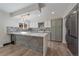 Modern kitchen features stainless steel appliances and updated cabinetry at 1827 Quail St # 3, Lakewood, CO 80215