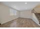 Living room with hardwood floors and a window with blinds at 1827 Quail St # 3, Lakewood, CO 80215
