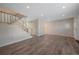 Living room with hardwood floors and a staircase at 1827 Quail St # 3, Lakewood, CO 80215
