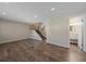 Spacious living room with hardwood floors and access to a bathroom at 1827 Quail St # 3, Lakewood, CO 80215