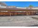 Covered carport parking with wooden fencing at 1827 Quail St # 3, Lakewood, CO 80215