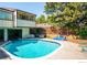 Community pool with surrounding patio furniture at 1827 Quail St # 3, Lakewood, CO 80215