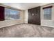 Living room featuring a modern dark-wood accent wall at 4050 S Odessa St, Aurora, CO 80013