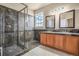 Bathroom with double vanity, large shower and dark tile at 4050 S Odessa St, Aurora, CO 80013