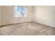 Bright bedroom with neutral walls and carpeting at 4050 S Odessa St, Aurora, CO 80013