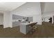 Open concept kitchen with island and hardwood floors at 2001 Lincoln St # 3223, Denver, CO 80202