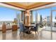 Breakfast nook with city views and a round table with four chairs at 2001 Lincoln St # 3223, Denver, CO 80202