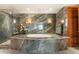 Elegant bathroom with a large soaking tub and walk-in shower at 2001 Lincoln St # 3223, Denver, CO 80202