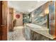 Bathroom with a large soaking tub and marble finishes at 2001 Lincoln St # 3223, Denver, CO 80202