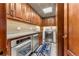 Convenient laundry room with built-in cabinets and appliances at 2001 Lincoln St # 3223, Denver, CO 80202