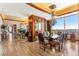 Formal dining room with large glass table and city view at 2001 Lincoln St # 3223, Denver, CO 80202