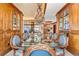 Elegant dining room with glass table and china cabinets at 2001 Lincoln St # 3223, Denver, CO 80202