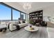 Spacious living room with city views and built-in shelving at 2001 Lincoln St # 3223, Denver, CO 80202