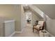 Upstairs hallway with comfy chair and view of office at 3622 W 29Th Ave, Denver, CO 80211