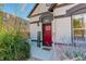 Craftsman style home exterior with red front door and landscaping at 3622 W 29Th Ave, Denver, CO 80211