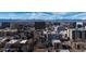 Panoramic aerial view of the city skyline and mountains at 550 E 12Th Ave # 907, Denver, CO 80203
