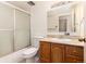 Simple bathroom with wood vanity and shower/tub combo at 550 E 12Th Ave # 907, Denver, CO 80203