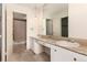 Clean bathroom with double sinks and a shower/tub combo at 550 E 12Th Ave # 907, Denver, CO 80203