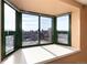 Bright room featuring a bay window with city views at 550 E 12Th Ave # 907, Denver, CO 80203