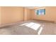 Bedroom with carpeted floors, neutral walls, and a window at 550 E 12Th Ave # 907, Denver, CO 80203