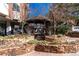 Charming gazebo with stonework and seating area at 550 E 12Th Ave # 907, Denver, CO 80203