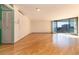 Spacious living room with hardwood floors and balcony access at 550 E 12Th Ave # 907, Denver, CO 80203