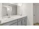 Double vanity bathroom with gray cabinets and marble countertop at 13332 E 110Th Way, Commerce City, CO 80022