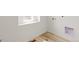 Laundry room with window and linoleum floor at 13332 E 110Th Way, Commerce City, CO 80022