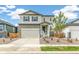 Two-story house with stone and siding exterior at 13332 E 110Th Way, Commerce City, CO 80022