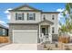 Two-story house with stone accents and a two-car garage at 13332 E 110Th Way, Commerce City, CO 80022