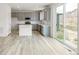 Modern kitchen featuring gray cabinets and a kitchen island at 13332 E 110Th Way, Commerce City, CO 80022