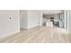Open concept living room with kitchen and hardwood floors at 13332 E 110Th Way, Commerce City, CO 80022