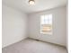 Bright bedroom with large window and neutral walls at 13332 E 110Th Way, Commerce City, CO 80022