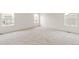 Bright bedroom featuring neutral carpeting and large windows at 13332 E 110Th Way, Commerce City, CO 80022