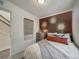Bedroom with terracotta accent wall and window at , Commerce City, CO 80022