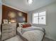 Cozy bedroom with terracotta accent wall and window at , Commerce City, CO 80022