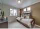 Small bedroom with wood bed and airplane art at , Commerce City, CO 80022