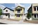 Two-story home with light yellow siding, balcony, and landscaping at , Commerce City, CO 80022