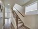 Modern staircase with metal railing and hardwood floors at , Commerce City, CO 80022