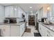 Updated kitchen featuring granite countertops and white cabinets at 109 Wooster Dr, Firestone, CO 80520