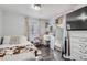 Bedroom with bed, dresser, and vanity area at 109 Wooster Dr, Firestone, CO 80520