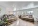 Bright and airy living room with comfortable seating at 109 Wooster Dr, Firestone, CO 80520