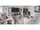 Spacious living room with modern furniture and fireplace at 109 Wooster Dr, Firestone, CO 80520