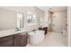 Modern bathroom with soaking tub and walk-in shower at 665 Scrubjay Cir, Castle Rock, CO 80104