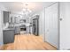 Open concept kitchen with gray cabinets and stainless steel appliances at 9340 E Center Ave # 8B, Denver, CO 80247
