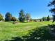 Landscaped grounds with lush grass, trees, and flowerbeds at 9340 E Center Ave # 8B, Denver, CO 80247