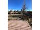Large backyard with grassy area and wooden deck at 3226 S Danube St, Aurora, CO 80013