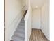 Staircase and flooring in a bright entryway at 6854 Merseyside Ln, Castle Pines, CO 80108