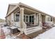 Rear exterior showing covered patio and landscaping at 7426 E 148Th Pl, Thornton, CO 80602